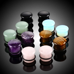 Polished natural stone ear plugs set featuring amethyst and quartz with O-ring seals