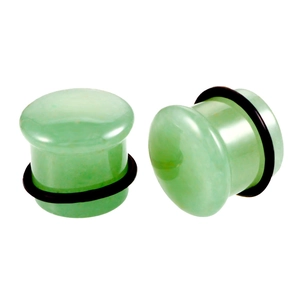 Close-up of green natural stone mushroom ear plugs with black rubber O-rings