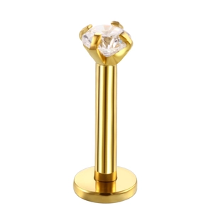 Detailed close-up of gold-plated stainless steel labret stud with a clear zircon stone