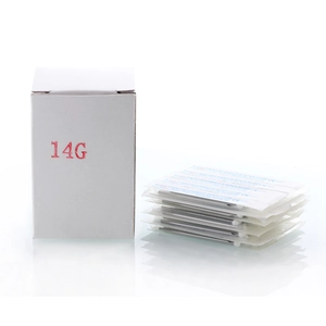 Macro view of 14G sterile body piercing needles with CE certification and packaging