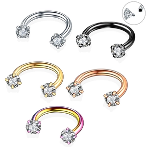 Macro detail of internally threaded stainless steel horseshoe rings with zirconia stones