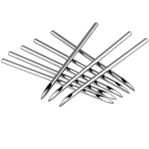 Close-up of stainless steel piercing needles with sharp bevelled tips for body piercing