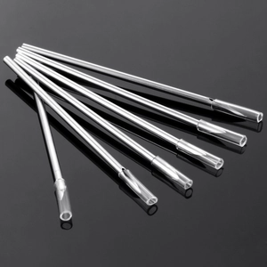 Set of stainless steel body piercing needles with sharp bevel tips and protective caps