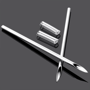 Close-up of sterile stainless steel piercing needles with silicone protective covers