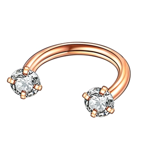 Rose gold horseshoe piercing ring with sparkling cubic zirconia on a white background
