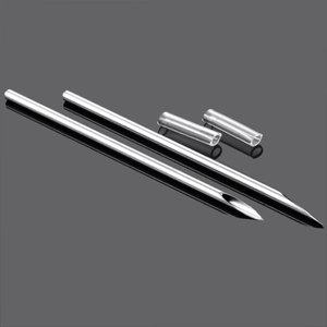 Macro shot of two sharp stainless steel body piercing needles with transparent covers