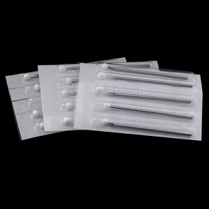 Close-up of sterile disposable body piercing needles with protective safety tips
