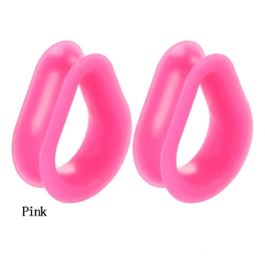 Detail of pink silicone teardrop ear tunnels in a symmetric layout on white background