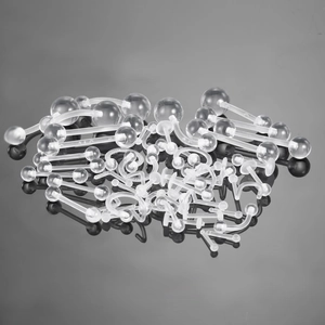 Transparent acrylic body jewelry set featuring belly, tongue, and eyebrow rings