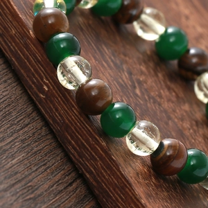 Handmade elastic bracelet featuring natural tiger eye stone and multi-colored round beads