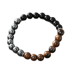 Obsidian, Hematite, and Tiger Eye beaded bracelet with silver spacers on white background