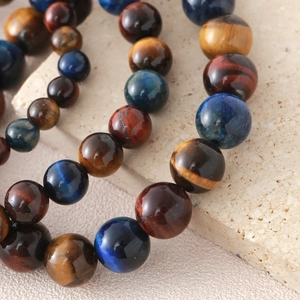 Handmade elastic bracelet with natural yellow, blue, and red tiger eye stone beads