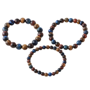 Three-piece tiger eye stone beaded bracelet set with blue, brown, and yellow silk luster