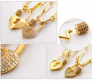 Detail of openable heart lock pendant with AAA cubic zirconia on gold Cuban chain