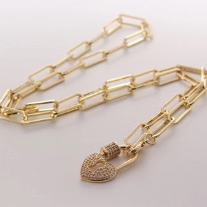 Golden paperclip chain necklace with a heart-shaped padlock pendant pavé-set with AAA zircons