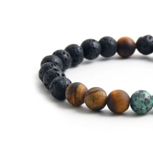 Natural lava rock and tiger eye beaded bracelet for men on a clean white background