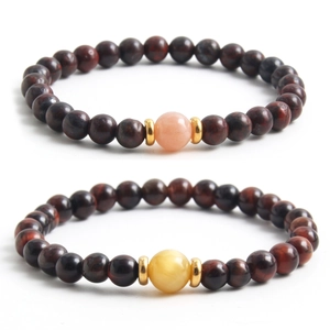 Natural red tiger eye beaded stretch bracelet with golden spacers and color accent beads