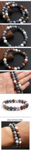 Close-up of mixed natural stone beads showing authentic textures and earthy colors