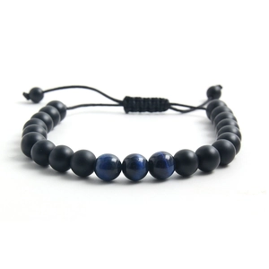 Pulsera artesanal de ojo de tigre con piedras negras mates y cordón tejido ajustable