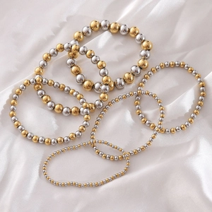 Bracelets extensibles bicolores en perles d'acier inoxydable or et argent sur soie