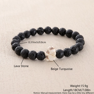 Detail of 8mm lava stone bracelet with turquoise skull bead and dimensions shown