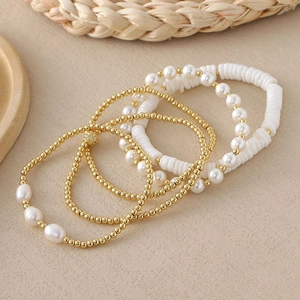 Bohemian style stackable bracelet set with 18K gold beads and white baroque pearls