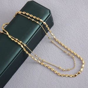 Chique dubbellaagse gouden kralenketting en ovale koffieboon halsketting dames