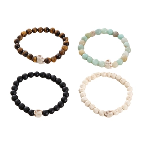 Set of four 8mm natural stone beaded bracelets with white skull charms in multiple colors