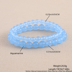 Macro shot of 6mm and 8mm aquamarine beaded bracelets with clear size measurements