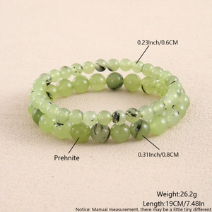 Detail of 6mm and 8mm prehnite beaded bracelets showing natural green stone texture