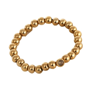 Polished 18K gold plated stainless steel beaded bracelet with a single zircon stone charm