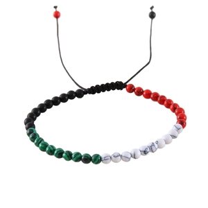 Adjustable woven beaded bracelet with green, black, white, and red natural stone beads