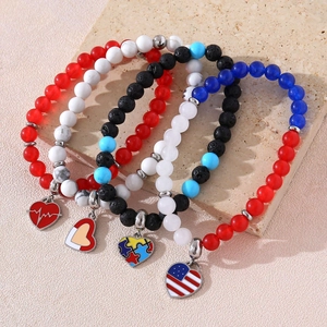 Patriotic beaded bracelet set with American flag heart charms and mixed colorful stone beads