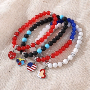 4-piece USA Patriotic beaded bracelet set with heart pendants and flag patterns