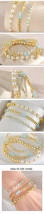 Close-up of stacked beaded bracelet set with gold copper beads and pearls