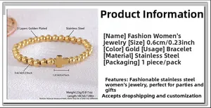 Vue détaillée du bracelet en perles d'acier doré avec pendentif croix et dimensions