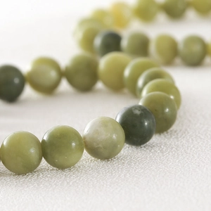 Natuurlijke Southern Jade kralenarmband met ronde groene kralen en elastisch koord