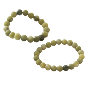Natuurlijke lichtgroene stenen kralenarmbanden met gladde ronde minerale textuur