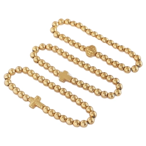 Ensemble de bracelets en perles dorées avec pendentifs croix et médaillons religieux polis