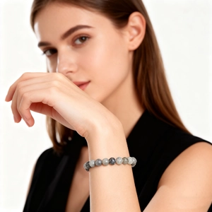 Bracelet élastique à une rangée en pierres naturelles de volcan marbrées grises et noires
