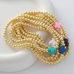 Set de 7 pulseras elásticas de cuentas doradas con colgantes de cruz de colores