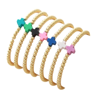 Set de 7 pulseras de cruz de colores con cuentas doradas pulidas y cordones elásticos