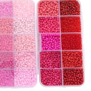 DIY jewelry kit with pink and red seed beads in a 10-grid transparent storage box