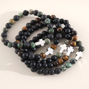Cross beaded bracelet set with tiger eye, lava rock and turquoise stones in a stacked layout