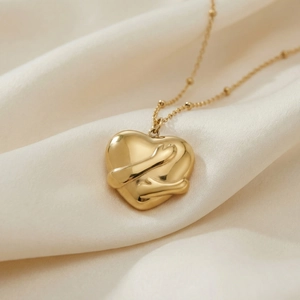 Gold plated stainless steel necklace featuring a 3D hug heart pendant on a bead chain