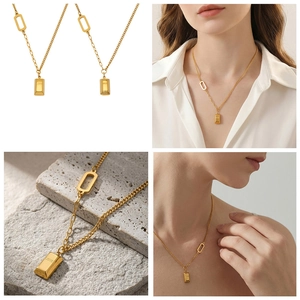 Detail view of 18k gold plated bar necklace with Love and Gold engravings