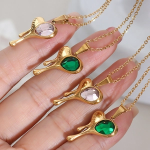 Golden heart pendant necklaces with teardrop crystal stones in green and pink