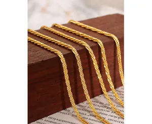 Detail of flat woven gold texture on titanium steel anklet with high metallic luster