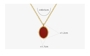 Detail of red oval pendant necklace in gold finish with 40+5cm chain size specs