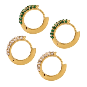 Set of gold hoop earrings with green and white zircon stones on a white background